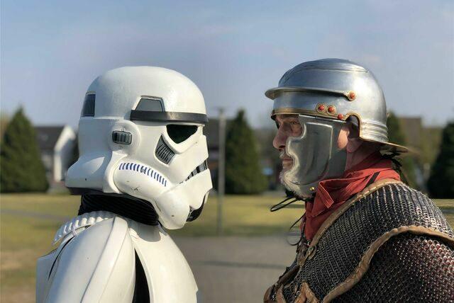 A roman soldier and imperial storm trooper face off